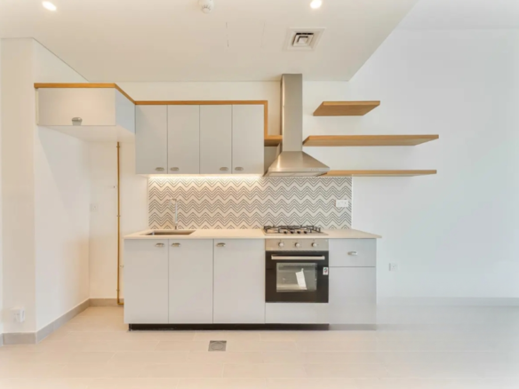 GolfVille DHE Emaar 1BR open kitchen